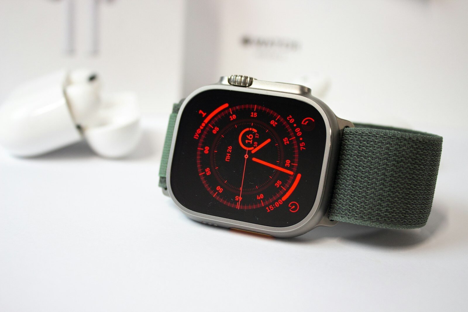a watch on a white surface